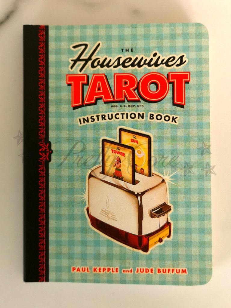 Housewives tarot booklet in blue gingham, with toaster and 2 tarot cards as the toast