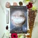 Moonology Book Yasmin Boland With Flowers and Crystals surrounding the book