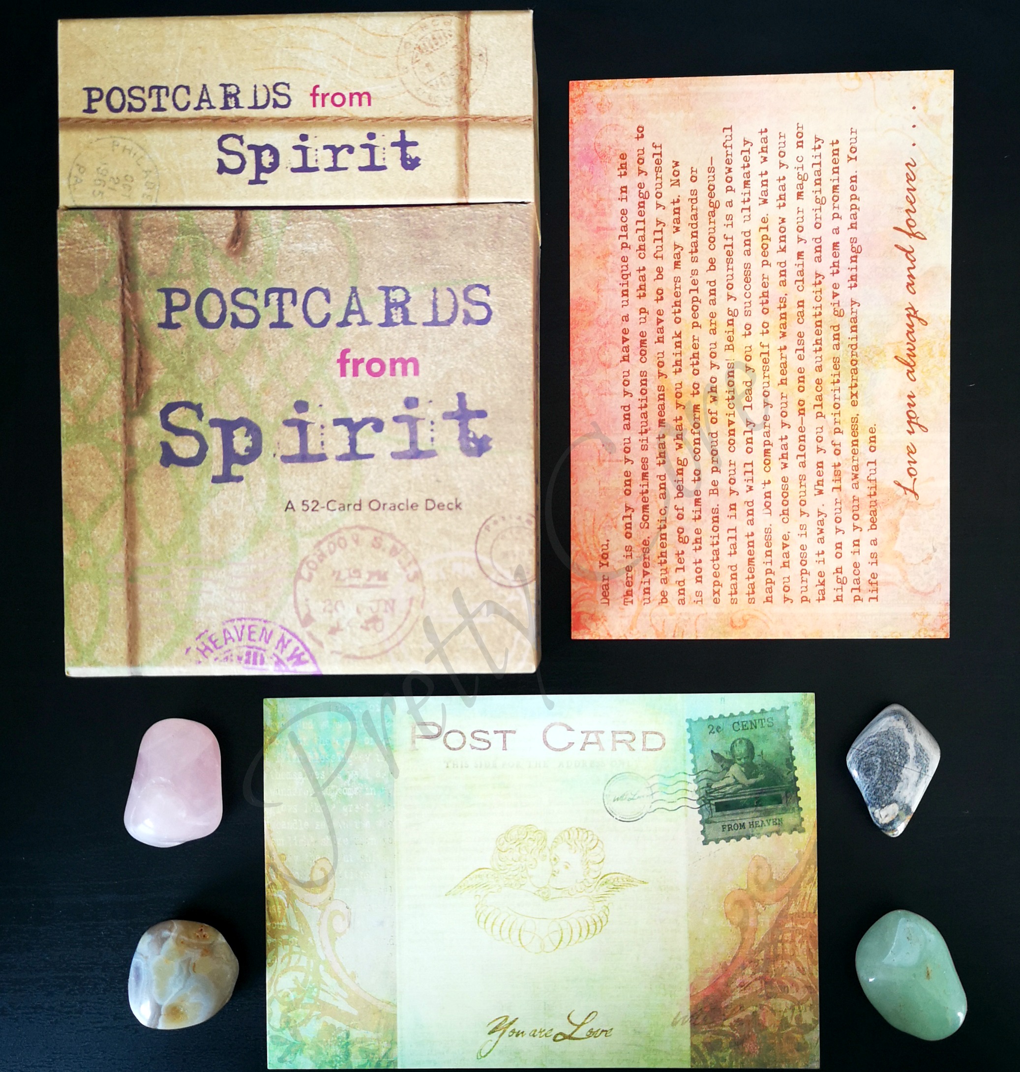 Review of postcards from spirit by colette baron-reid flat lay with crystals, showing the packaging and cards