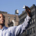 Man holding up a camera to take a selfie