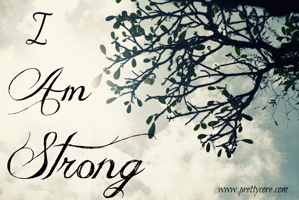I am strong with a tree on the right hand side in sepia and black