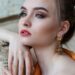 Woman posting and picking jewelry