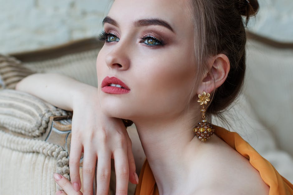 Woman posting and picking jewelry
