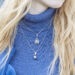 Young fashionable woman wearing luxury pendant of unique designs