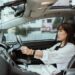 Woman sat in a new car as How To Fund The Purchase Of A New Car