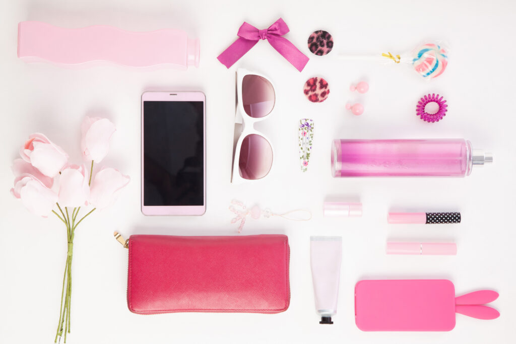 Beauty Trends for 2021 showing pink beauty items such as sunglasses, phone cases and accessories, flowers and makeup