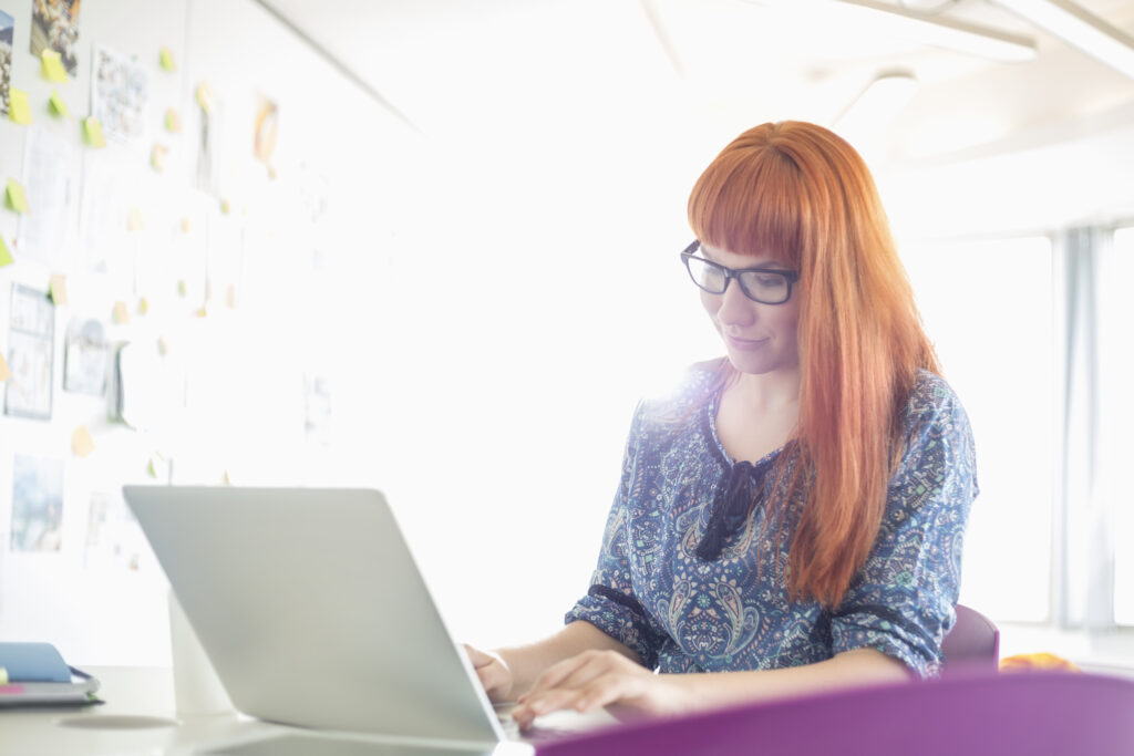 Woman sat at her laptop 4 Tips To Find Love In Lockdown - Finding Love During Lockdown