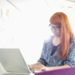 Woman sat at her laptop 4 Tips To Find Love In Lockdown - Finding Love During Lockdown