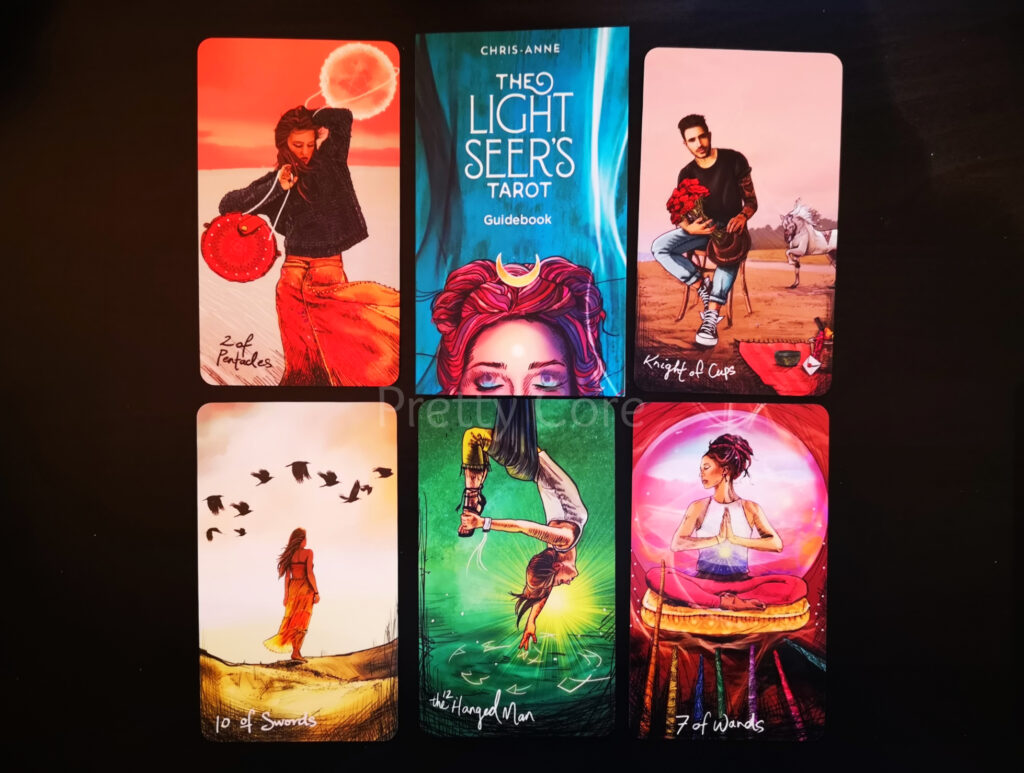 The Light Seers Tarot showing a few cards and the guide book