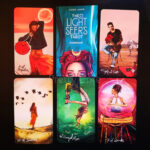 The Light Seers Tarot showing a few cards and the guide book