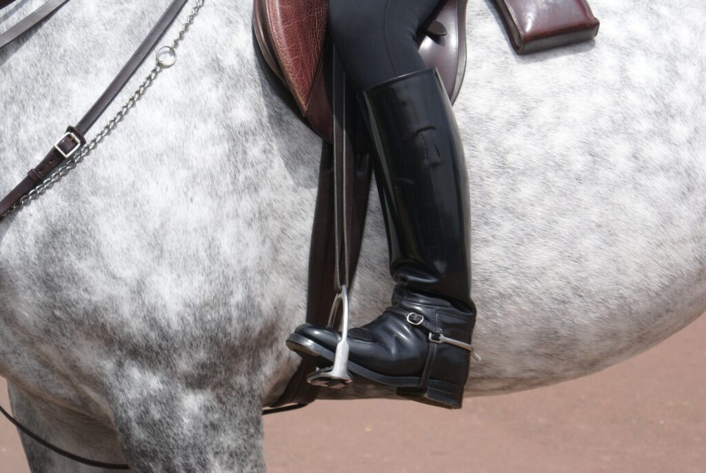 Person n a horse showing their horse riding boots