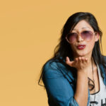How to Make Better Decisions for Yourself Young woman blowing kisses over colored background