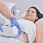 Pretty young woman getting cryolipolyse treatment in professional cosmetic cabinet What Are the Benefits of CoolSculpting and Is It Right for You?